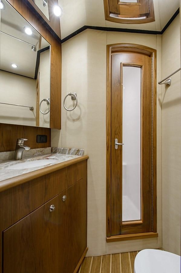 a bathroom with a sink and a toilet aboard BANGARANG Yacht for Sale