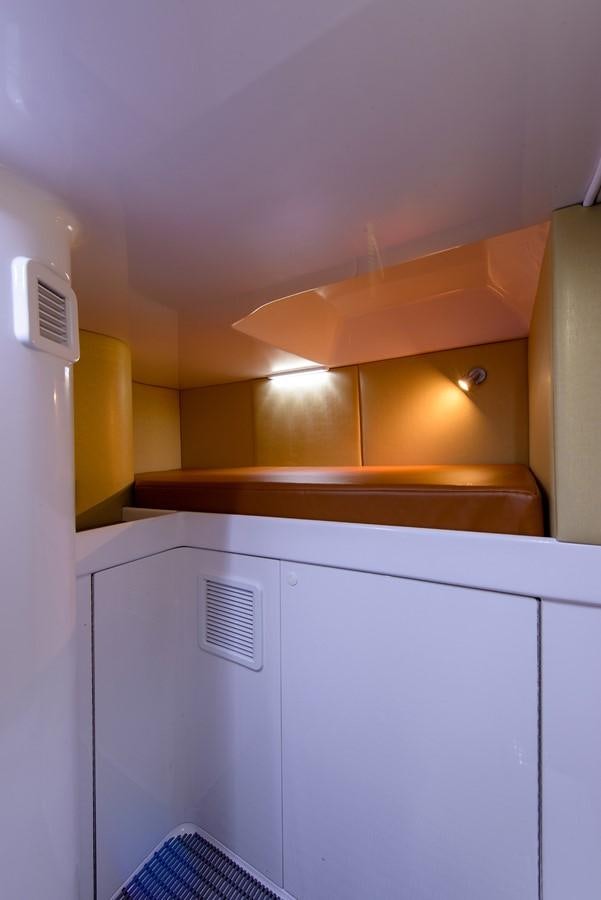 a white kitchen with a ceiling aboard BANGARANG Yacht for Sale