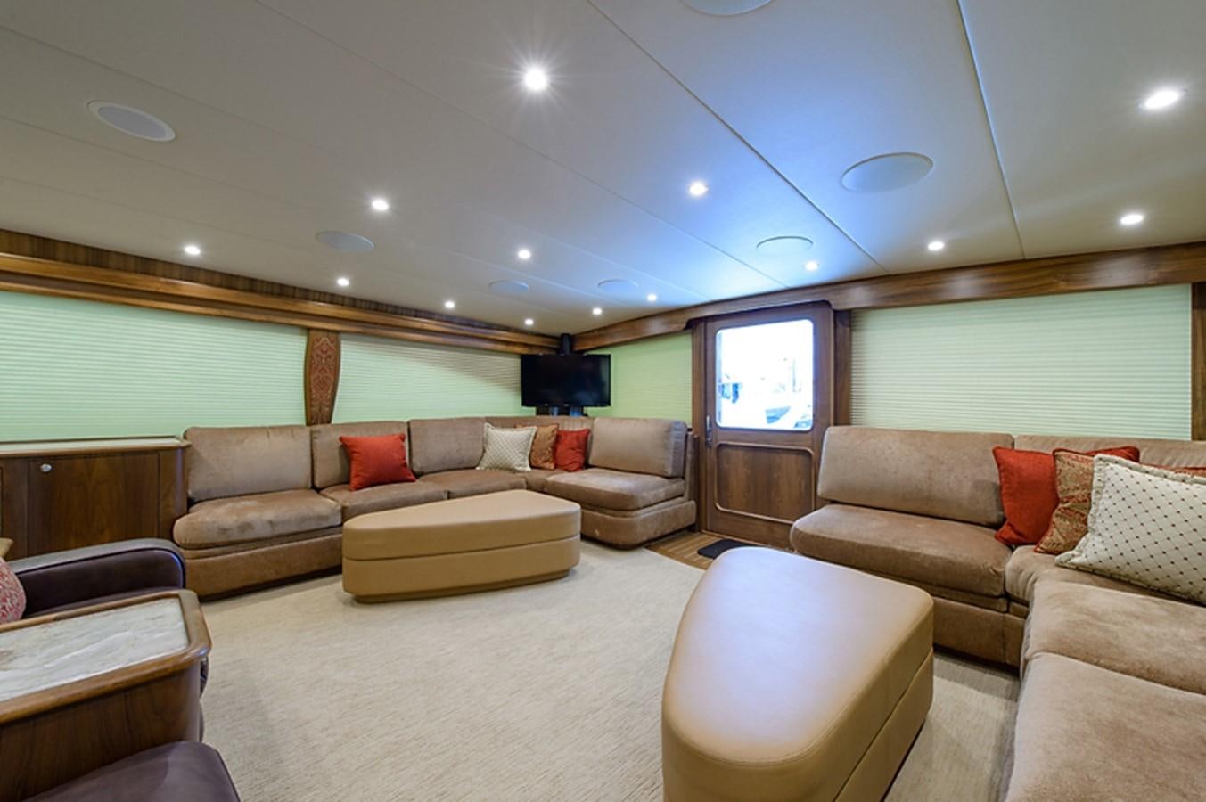 a living room with a large window aboard BANGARANG Yacht for Sale