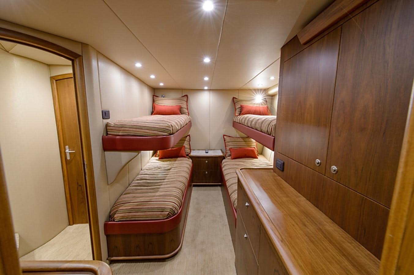 a room with a bed and a mirror aboard BANGARANG Yacht for Sale