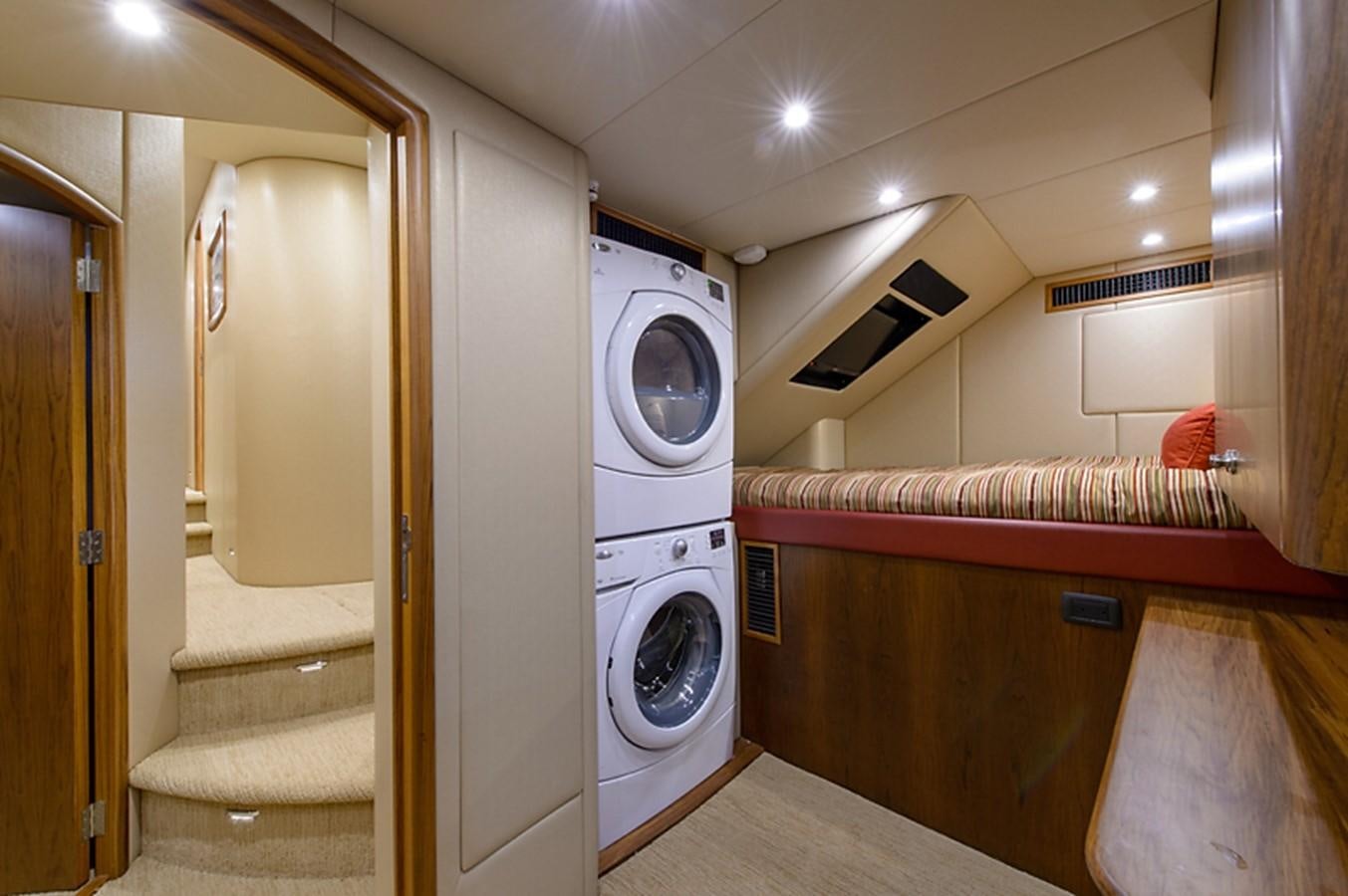 a laundry room with a washing machine aboard BANGARANG Yacht for Sale