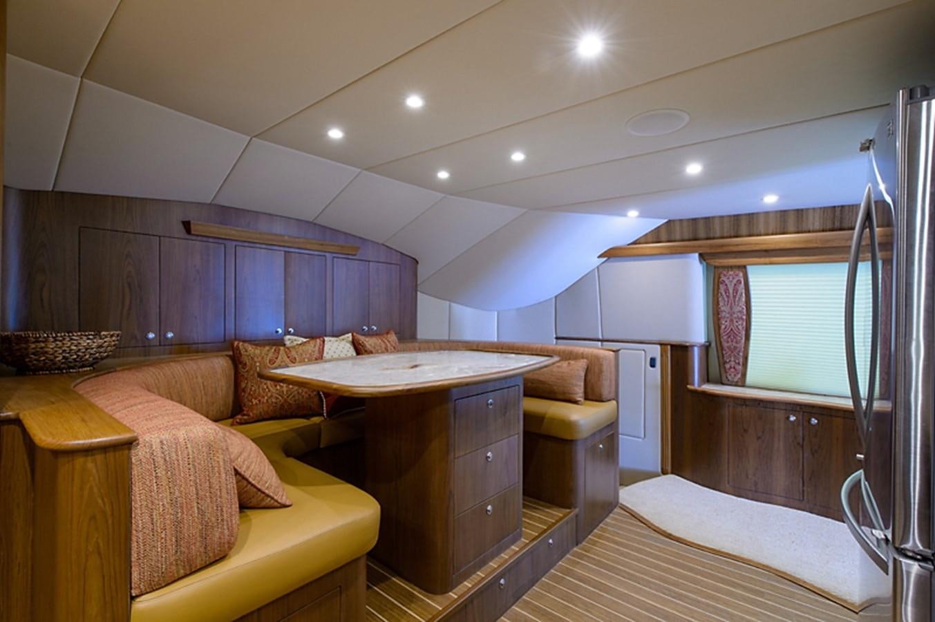a living room with a desk and couch aboard BANGARANG Yacht for Sale