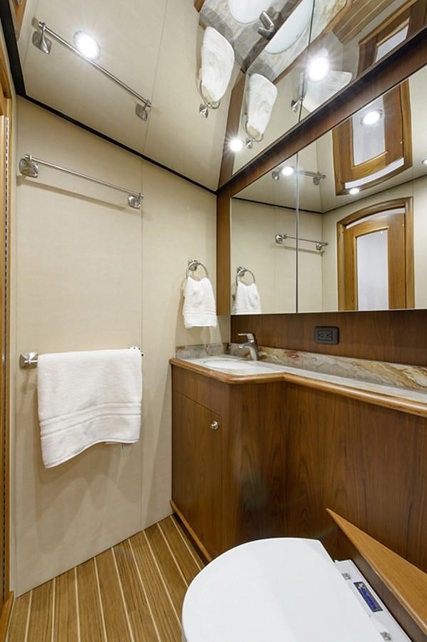 a bathroom with a shower and toilet aboard BANGARANG Yacht for Sale
