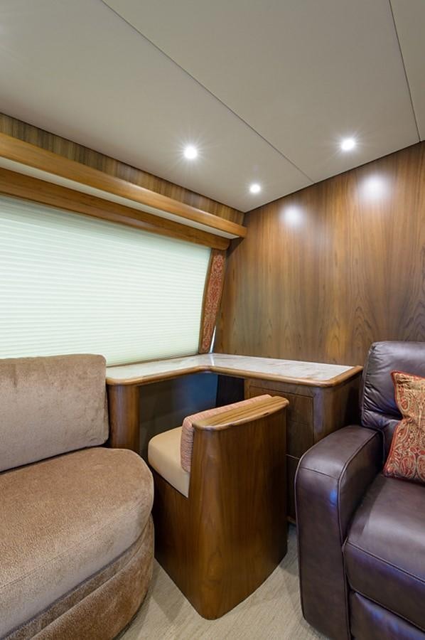 a room with a couch and a chair aboard BANGARANG Yacht for Sale