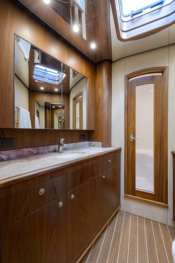 a bathroom with a large mirror aboard BANGARANG Yacht for Sale