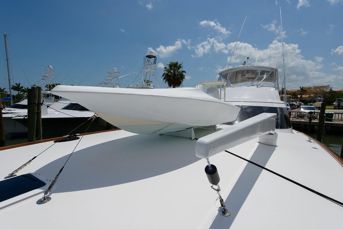 a white boat on a dock aboard BANGARANG Yacht for Sale