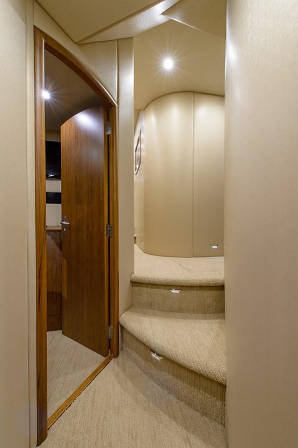 a bathroom with a wood door aboard BANGARANG Yacht for Sale