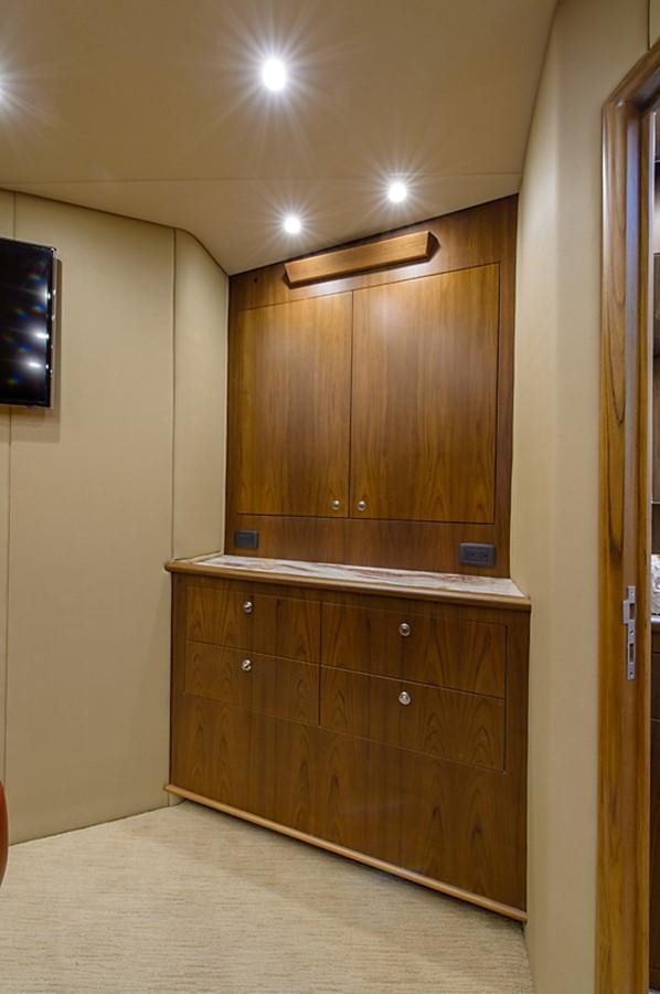 a room with a wood cabinet aboard BANGARANG Yacht for Sale