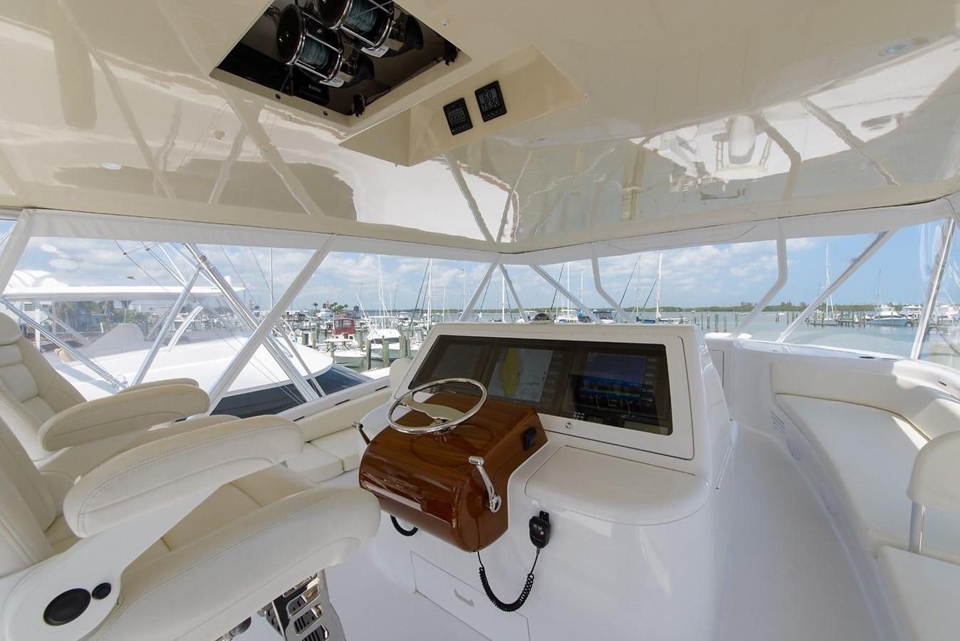 a white yacht with a laptop on it aboard BANGARANG Yacht for Sale