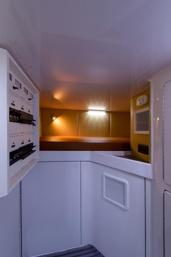 a kitchen with white cabinets aboard BANGARANG Yacht for Sale