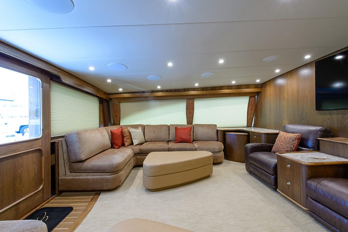 a living room with leather couches aboard BANGARANG Yacht for Sale