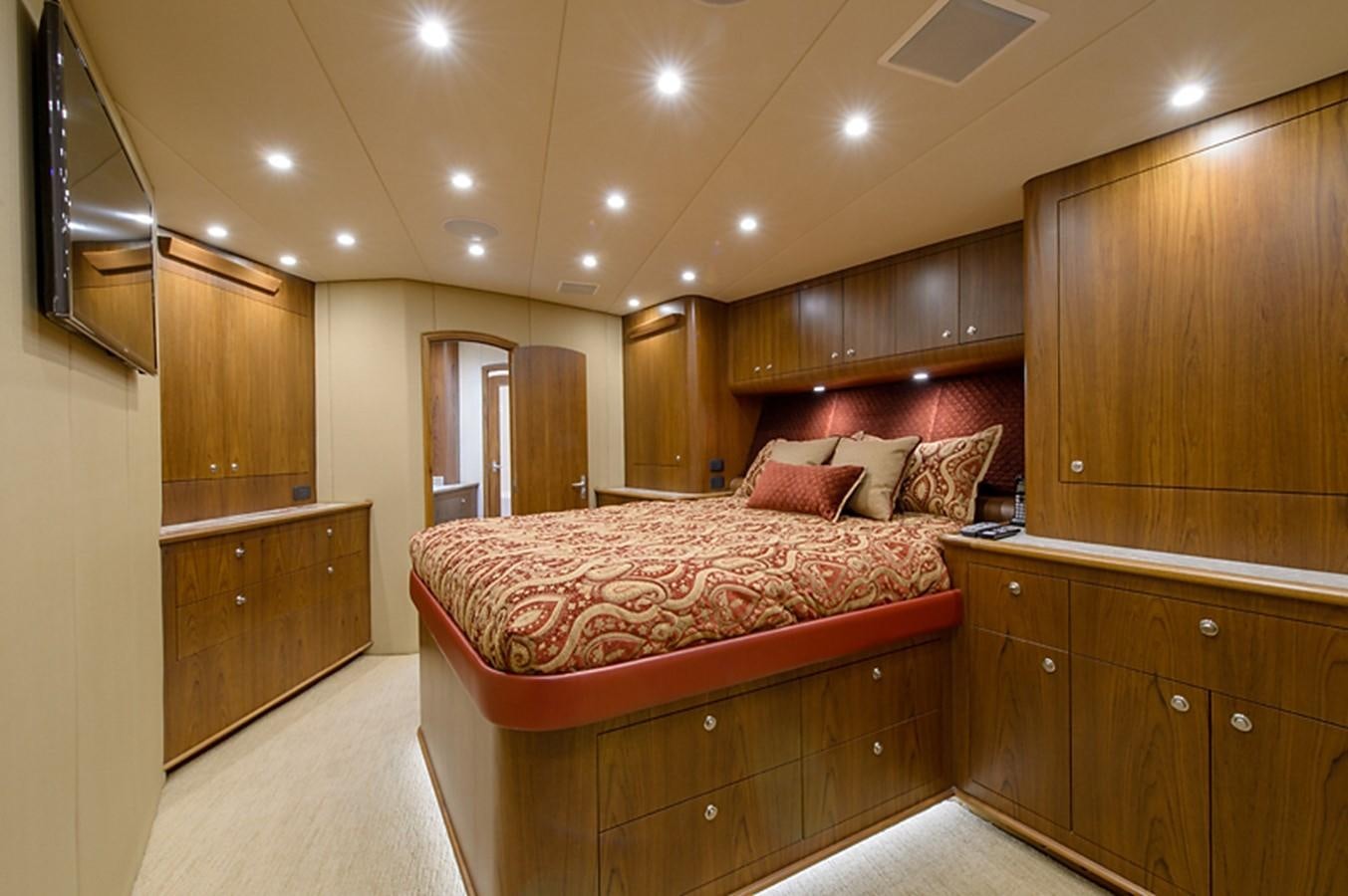 a large bedroom with a large bed aboard BANGARANG Yacht for Sale
