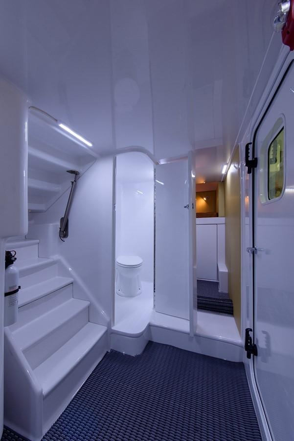 a bathroom with a urinal aboard BANGARANG Yacht for Sale