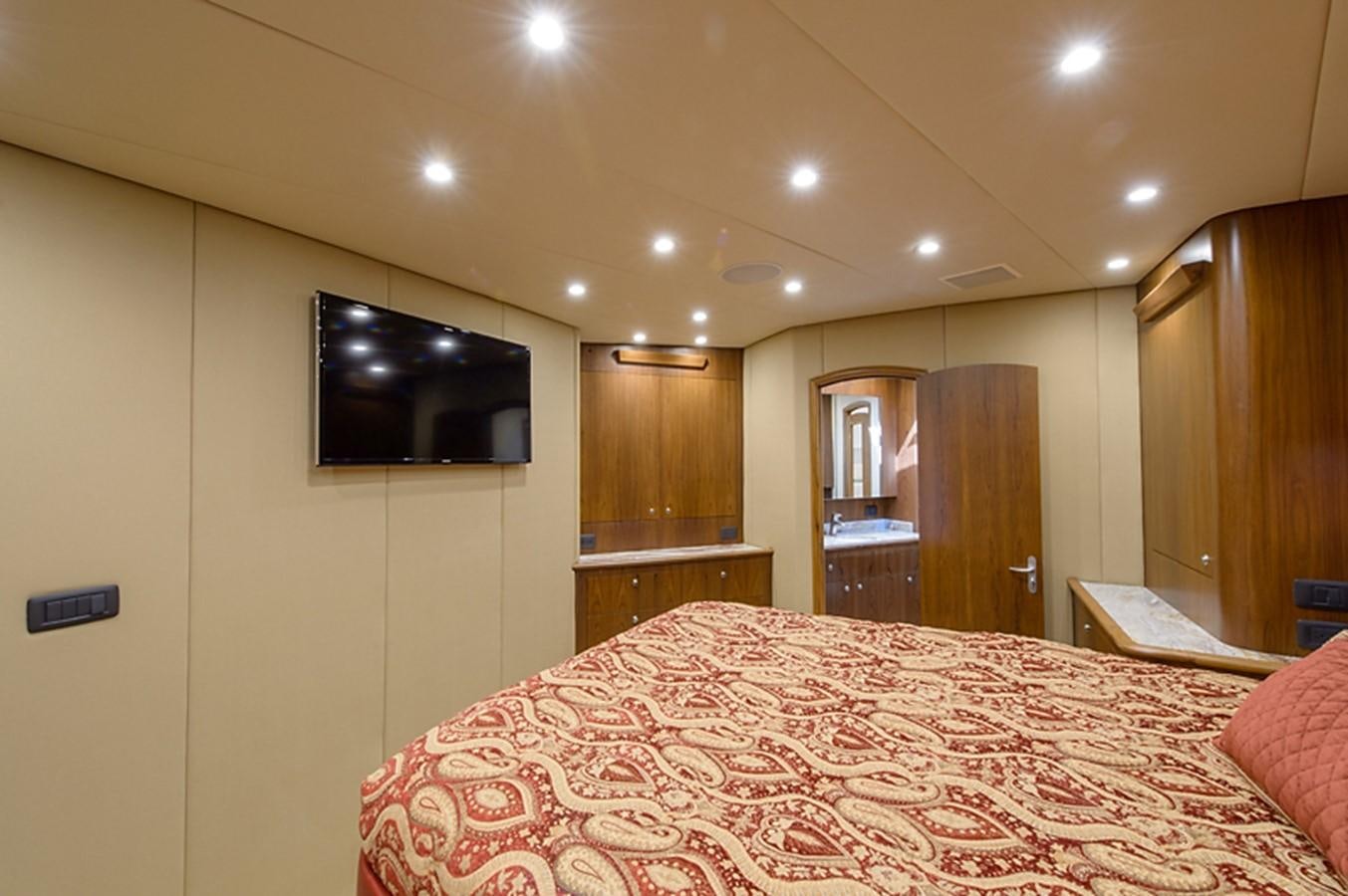 a hotel room with a bed aboard BANGARANG Yacht for Sale