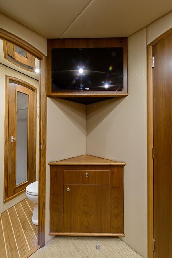 a bathroom with a wood cabinet aboard BANGARANG Yacht for Sale