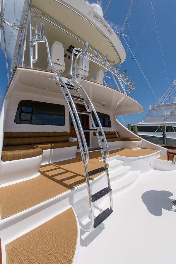 a white spiral staircase aboard BANGARANG Yacht for Sale