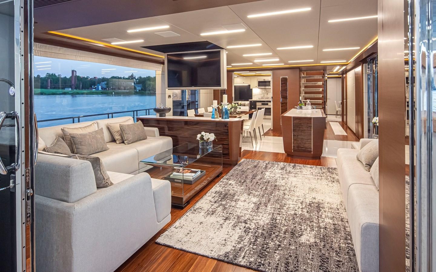 a living room with a large window aboard 90R03 Yacht for Sale