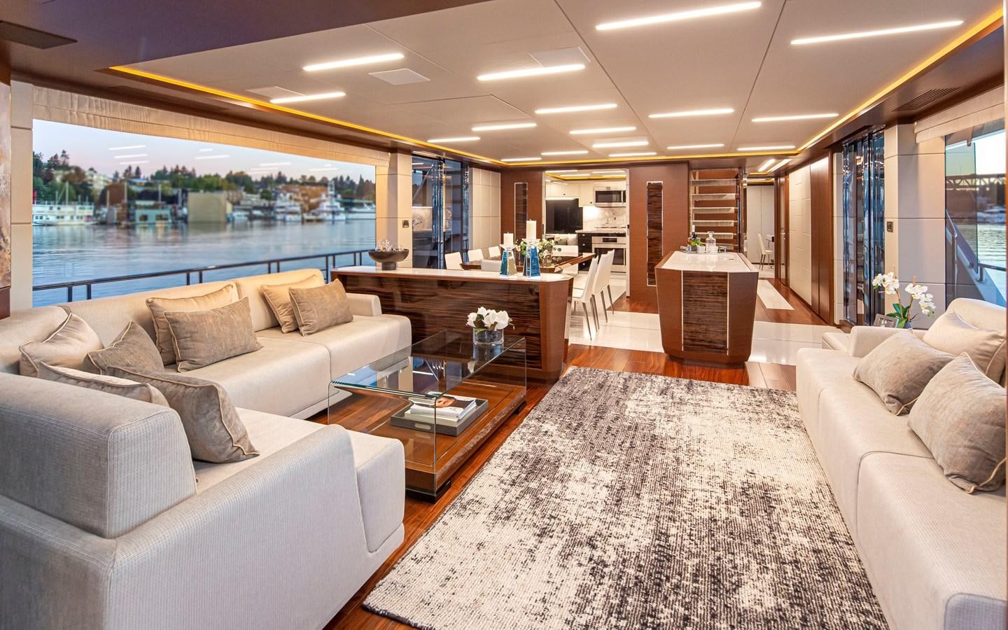 a living room with a large window aboard 90R03 Yacht for Sale