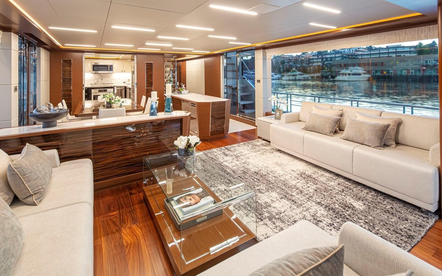 a living room with a large window aboard 90R03 Yacht for Sale