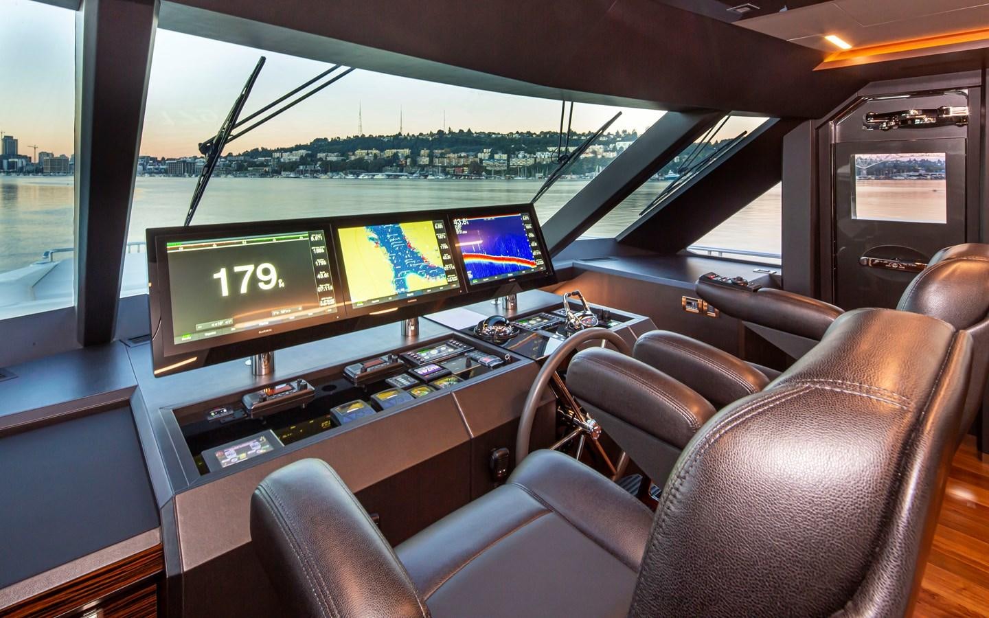 inside of a car with monitors and seats aboard 90R03 Yacht for Sale