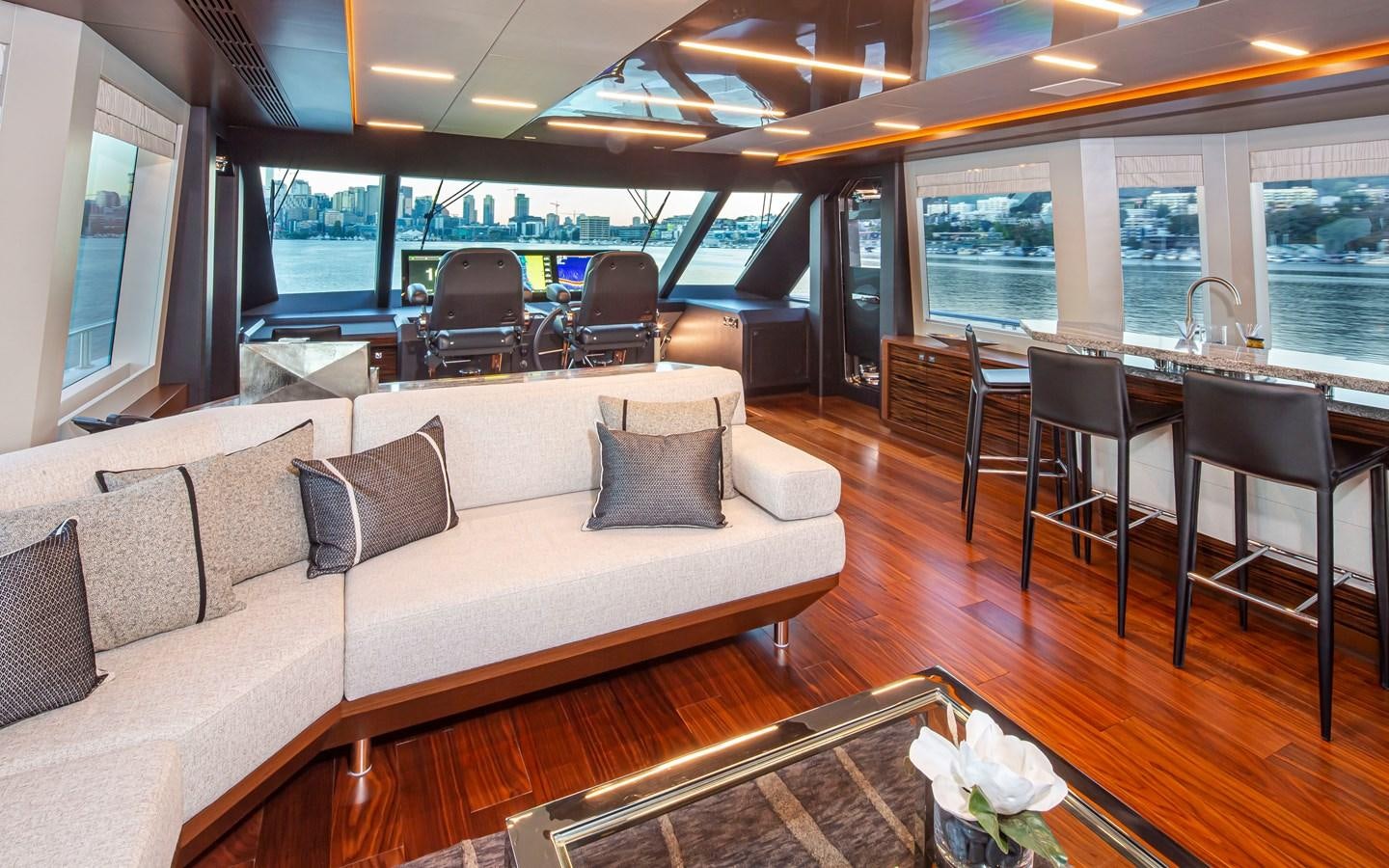 a living room with a couch and a table aboard 90R03 Yacht for Sale