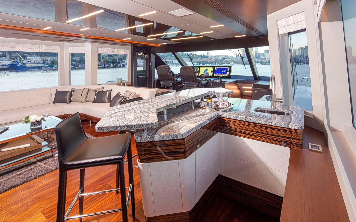 a room with a couch and a table aboard 90R03 Yacht for Sale