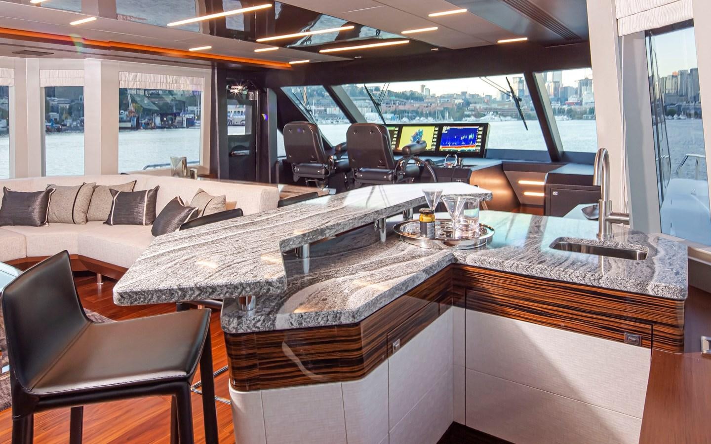 a room with a table and chairs aboard 90R03 Yacht for Sale