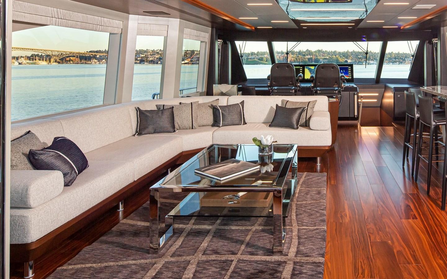 a living room with a couch and a table aboard 90R03 Yacht for Sale