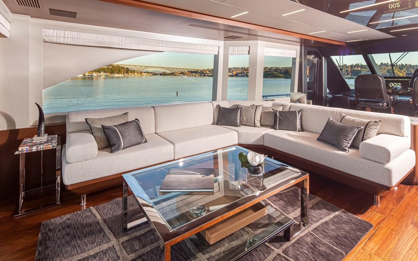 a living room with a large glass window aboard 90R03 Yacht for Sale