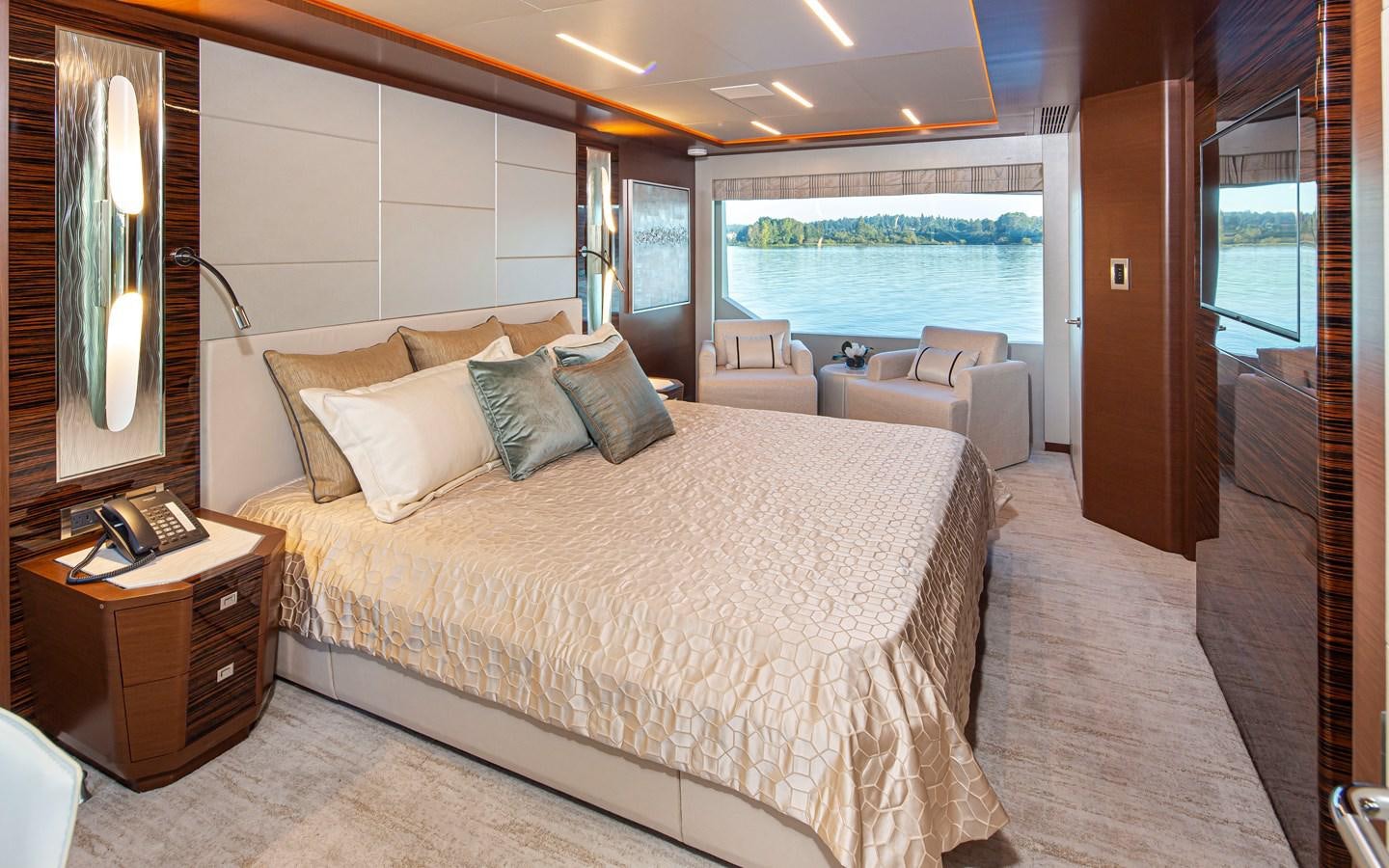 a large bed in a hotel room aboard 90R03 Yacht for Sale