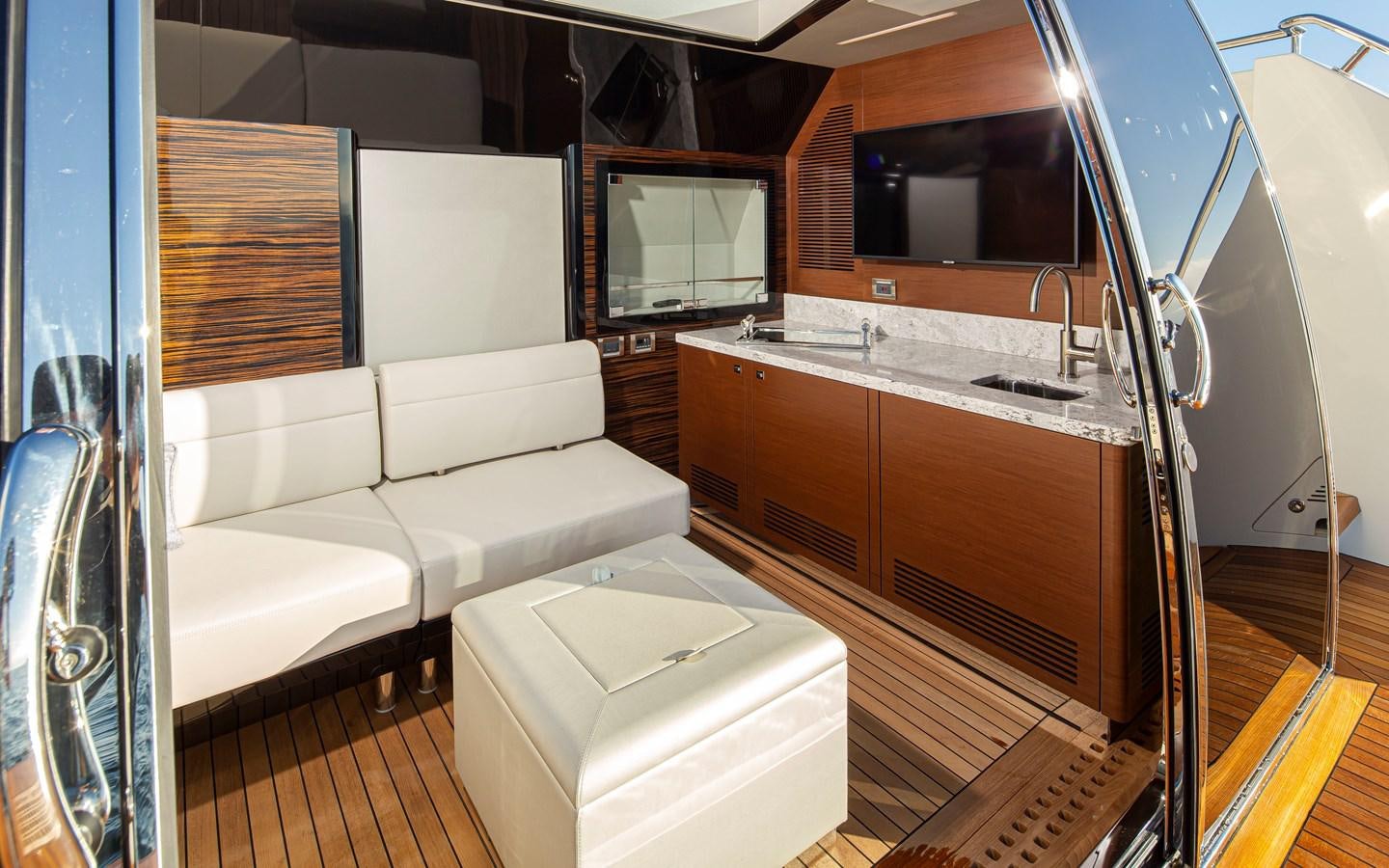 a living room with a couch and a television aboard 90R03 Yacht for Sale