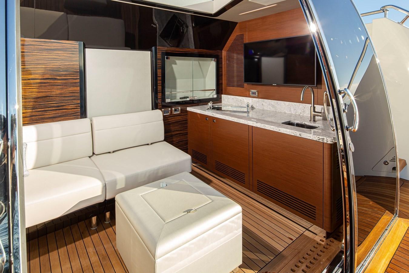 a living room with a couch and a television aboard 90R03 Yacht for Sale