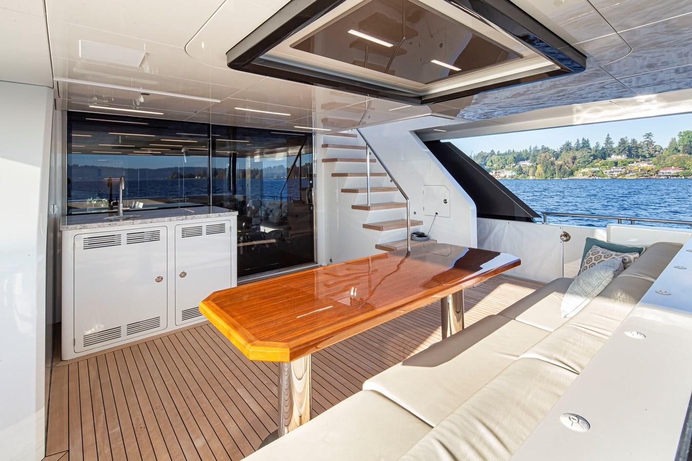 a room with a table and chairs aboard 90R03 Yacht for Sale