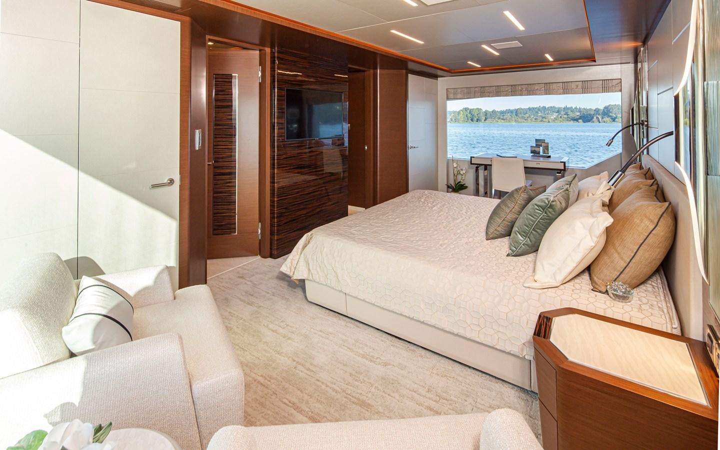 a bedroom with a large bed aboard 90R03 Yacht for Sale