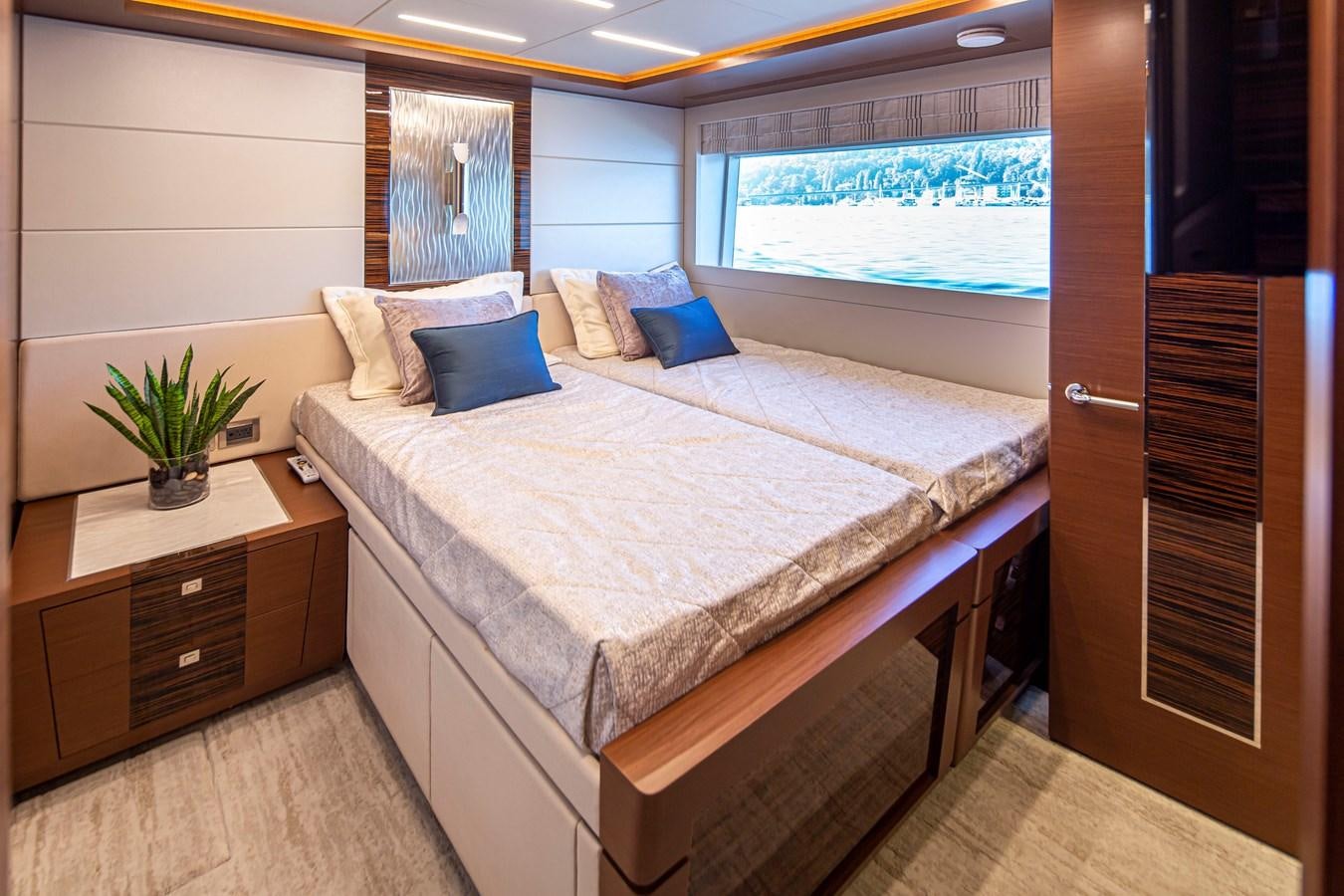 a bed in a room aboard 90R03 Yacht for Sale