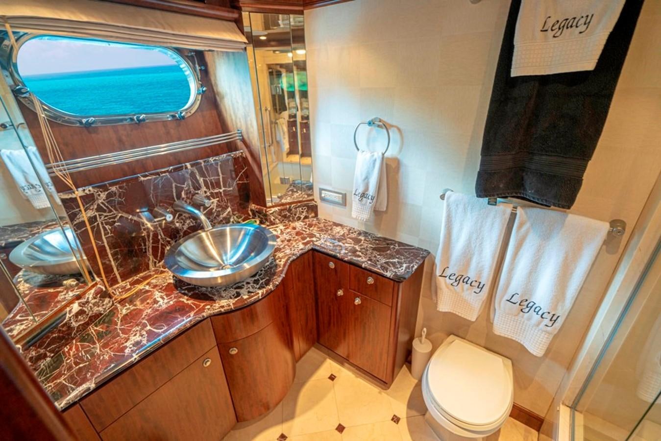 a bathroom with marble counter tops aboard GRAND LEGACY Yacht for Sale
