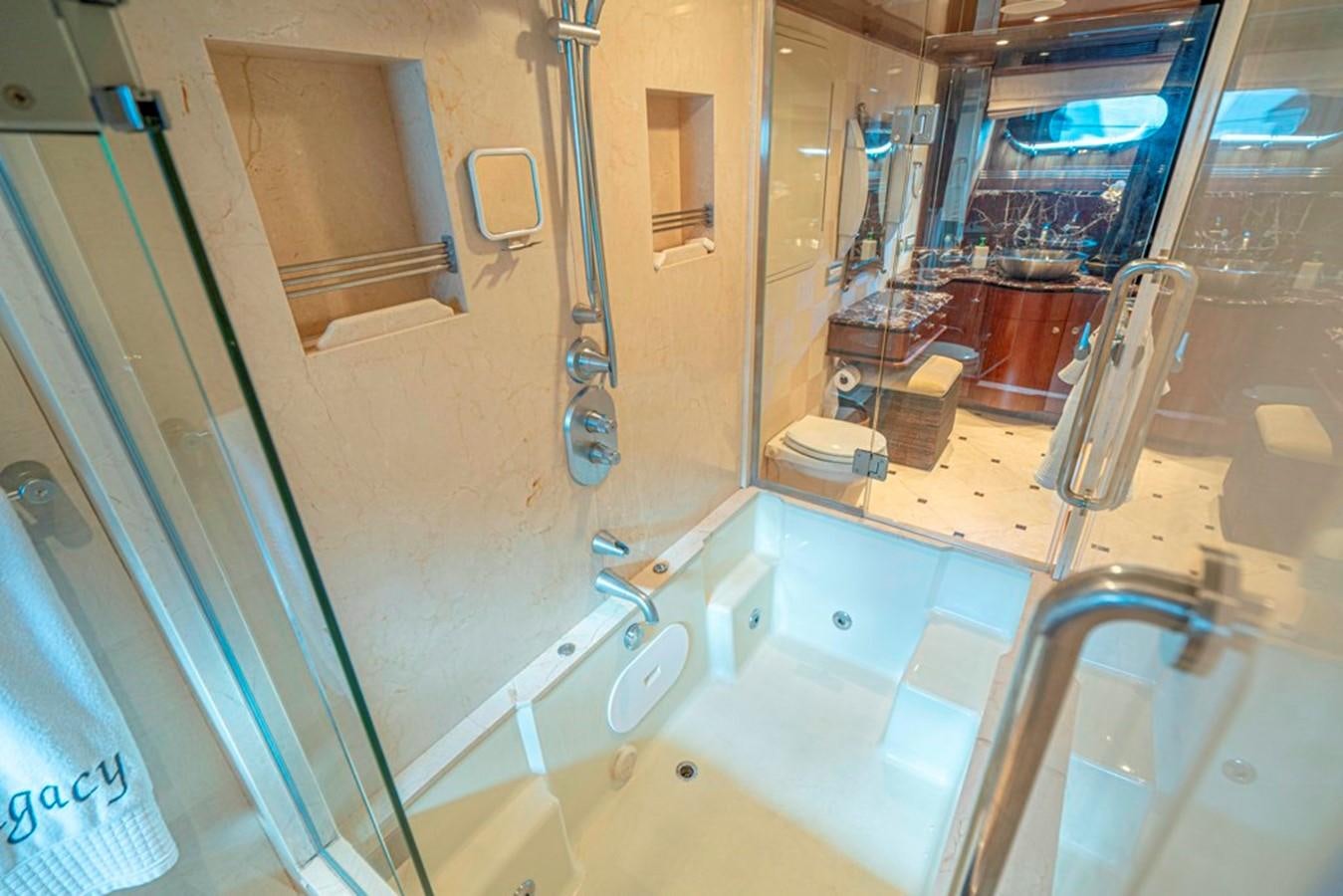 a bathroom with a bathtub and sink aboard GRAND LEGACY Yacht for Sale
