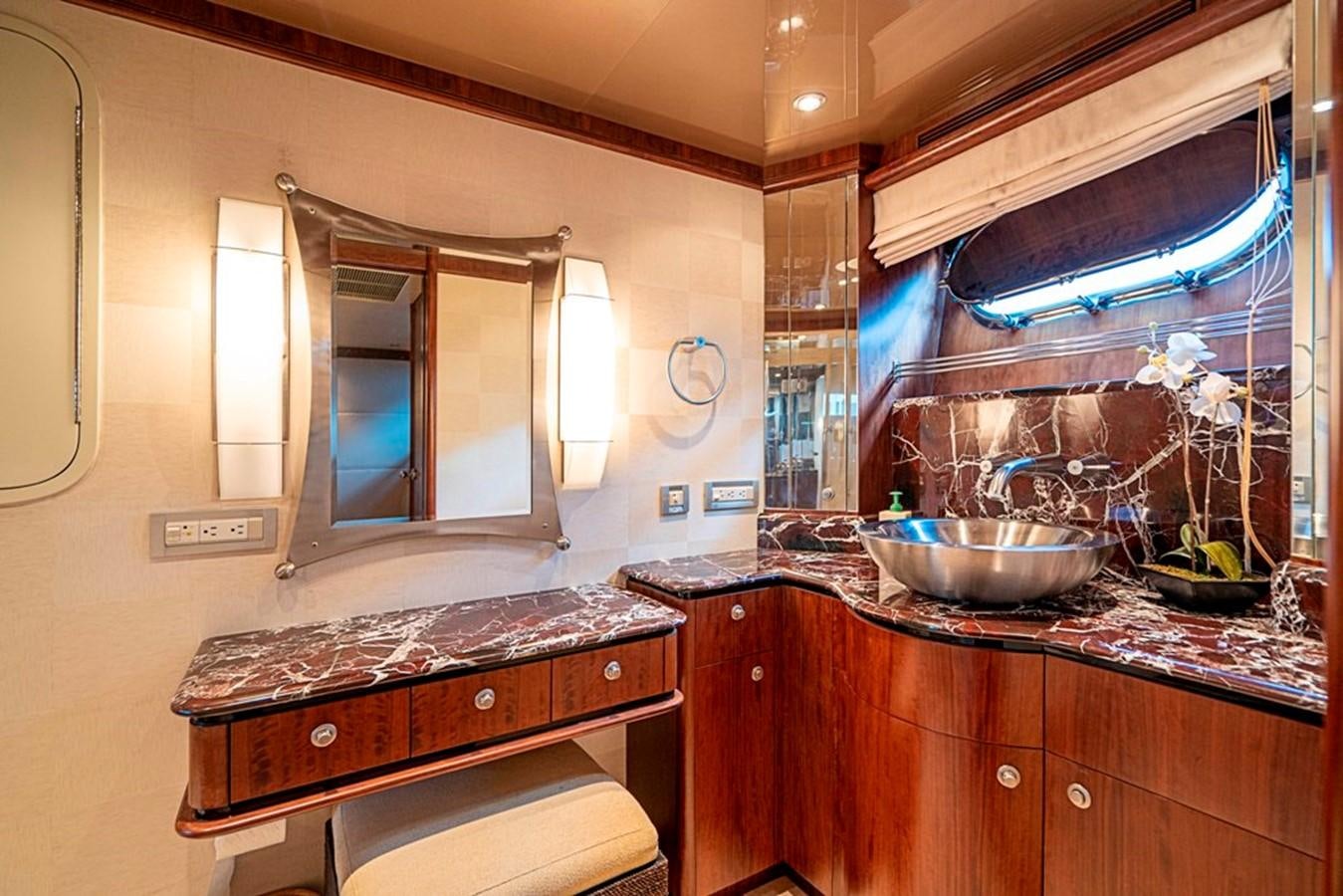 a bathroom with a sink and a mirror aboard GRAND LEGACY Yacht for Sale