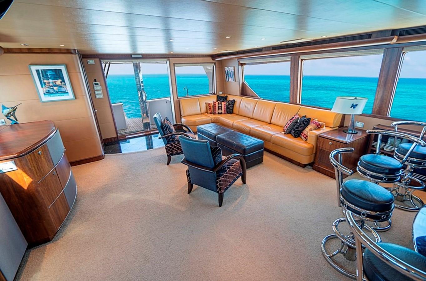 a living room with a couch and a table aboard GRAND LEGACY Yacht for Sale