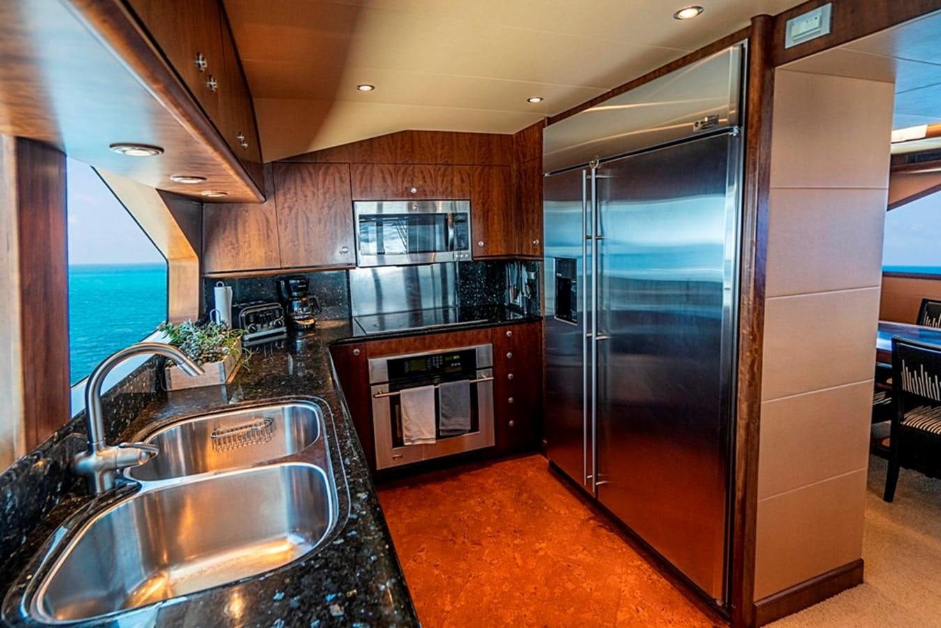 a kitchen with stainless steel appliances aboard GRAND LEGACY Yacht for Sale