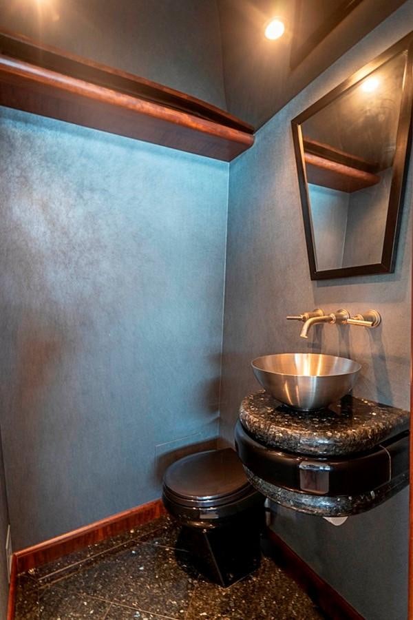 a bathroom with a sink and a mirror aboard GRAND LEGACY Yacht for Sale