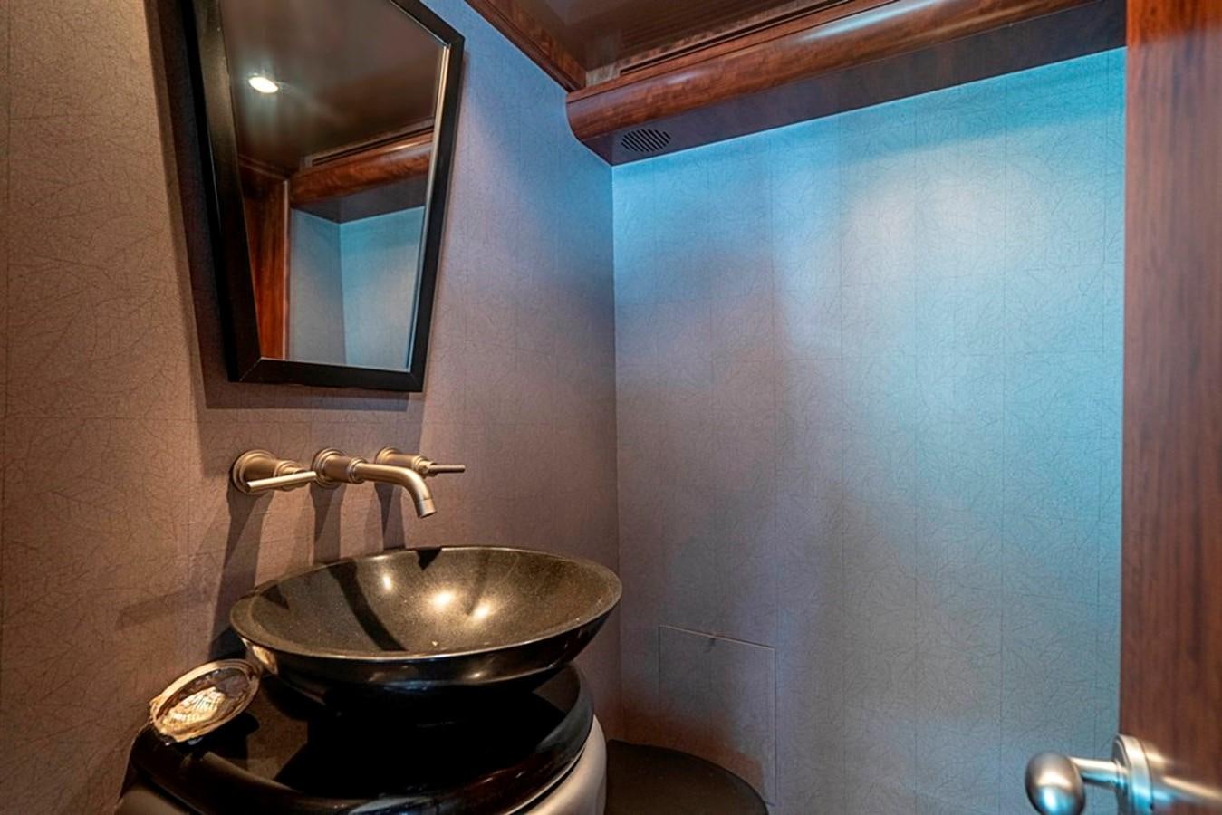 a bathroom with a sink and a mirror aboard GRAND LEGACY Yacht for Sale