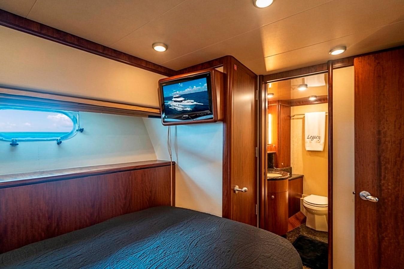 a bedroom with a large bed aboard GRAND LEGACY Yacht for Sale