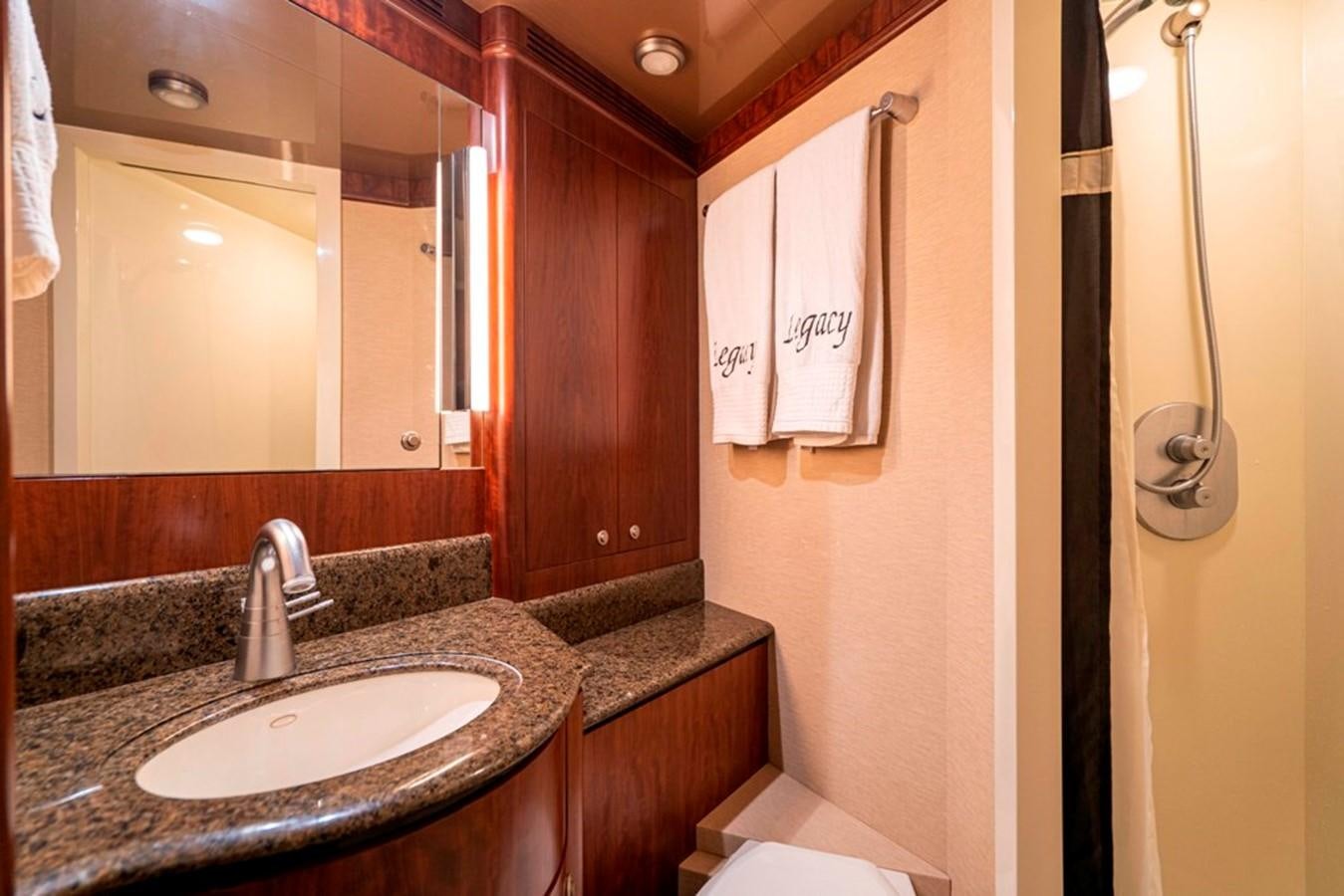 a bathroom with a sink and toilet aboard GRAND LEGACY Yacht for Sale