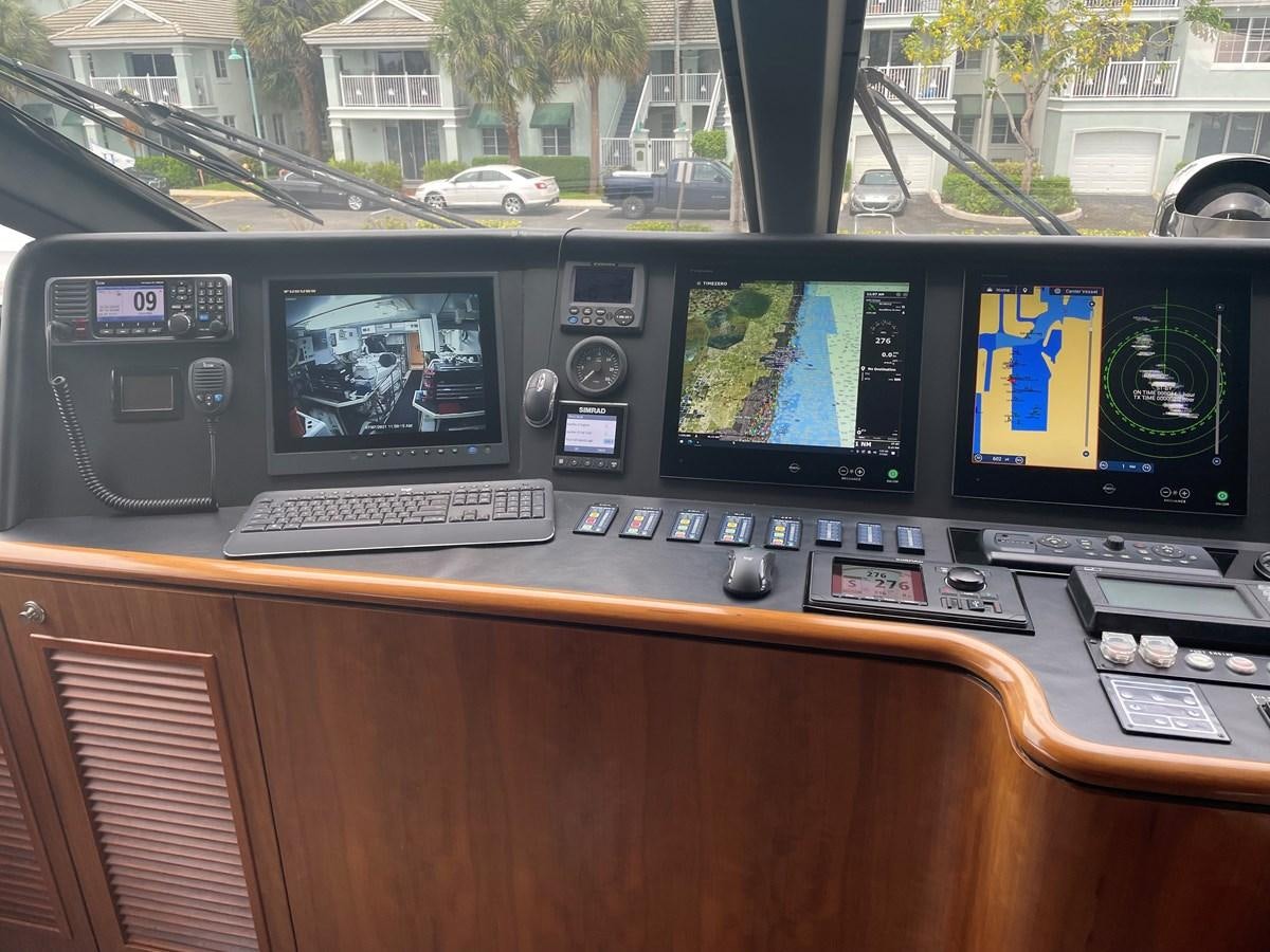 a desk with computers and monitors aboard GRAND LEGACY Yacht for Sale