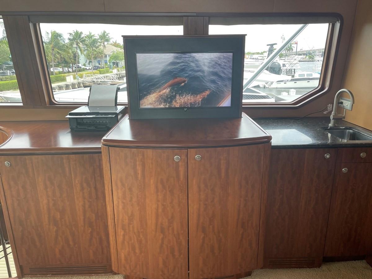 a tv on a cabinet aboard GRAND LEGACY Yacht for Sale
