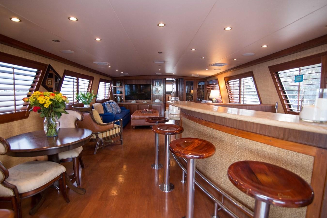 a living room with a table and chairs aboard NEXT DEAL Yacht for Sale