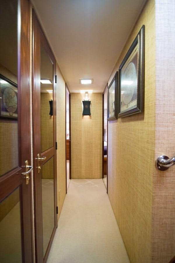 a hallway with a door and a mirror aboard NEXT DEAL Yacht for Sale
