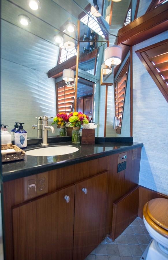 a bathroom with a sink and cabinets aboard NEXT DEAL Yacht for Sale