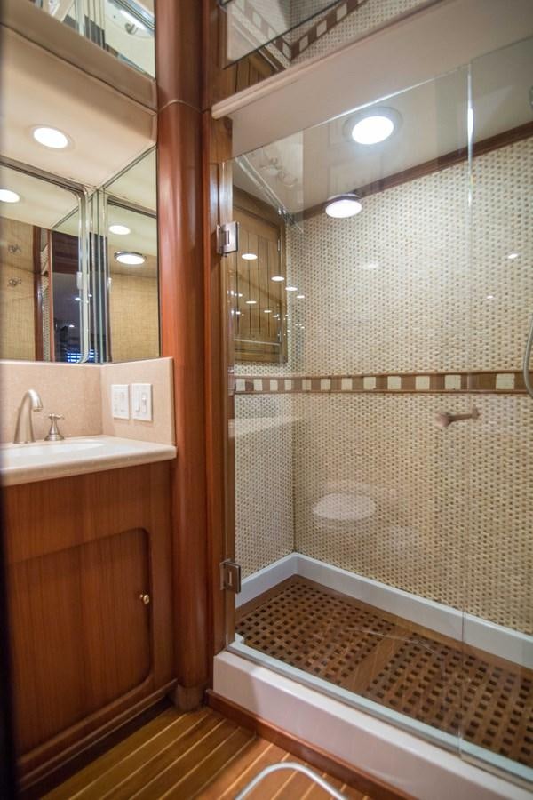 a bathroom with a shower and sink aboard NEXT DEAL Yacht for Sale
